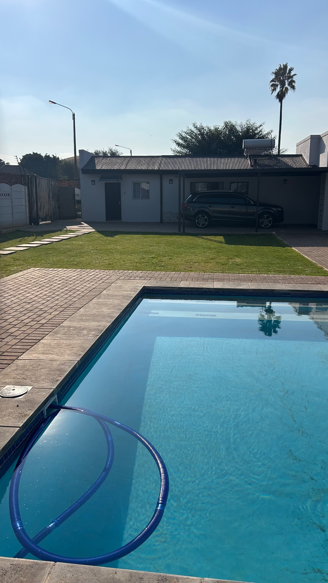Swimming pool and lawn area at Phela Guesthouse